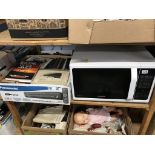 A shelf of assorted to include a microwave