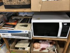 A shelf of assorted to include a microwave