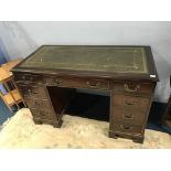 A reproduction mahogany pedestal desk