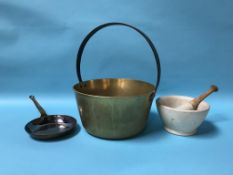 A pestle and mortar, a jam pan and a copper pan