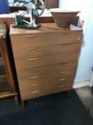 A teak chest of seven drawers, 75cm wide