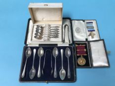 A cased set of silver spoons, silver gilt Masonic medals and a set of Continental spoons