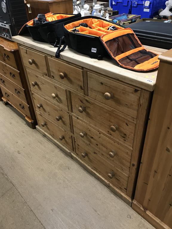 A pine chest of drawers, with nine drawers, 133cm wide x 105cm height