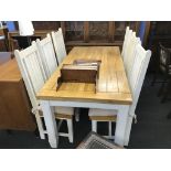 A kitchen table and six chairs