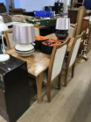 A dining table and five chairs
