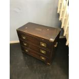 A reproduction mahogany campaign style chest of three drawers, with brushing slide, 61cm wide