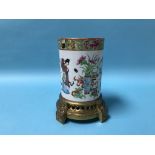 A Chinese famille rose brush pot, supported on a pierced gilt metal stand, 19cm height
