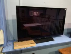 An OLED LG TV, with remote
