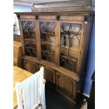 A good reproduction mahogany concave and breakfront bookcase, with three glazed doors and