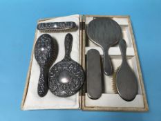 A cased silver brush set, along with one other