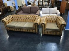 A Chesterfield three seater settee and a Club chair