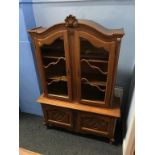 A Continental oak display cabinet