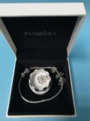 A boxed Pandora bracelet and a Thomas Sabo charm