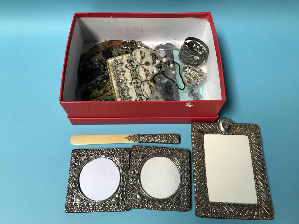 Various silver picture frames and beaded purses etc.