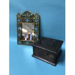 A small carved wood box and a decorative mirror