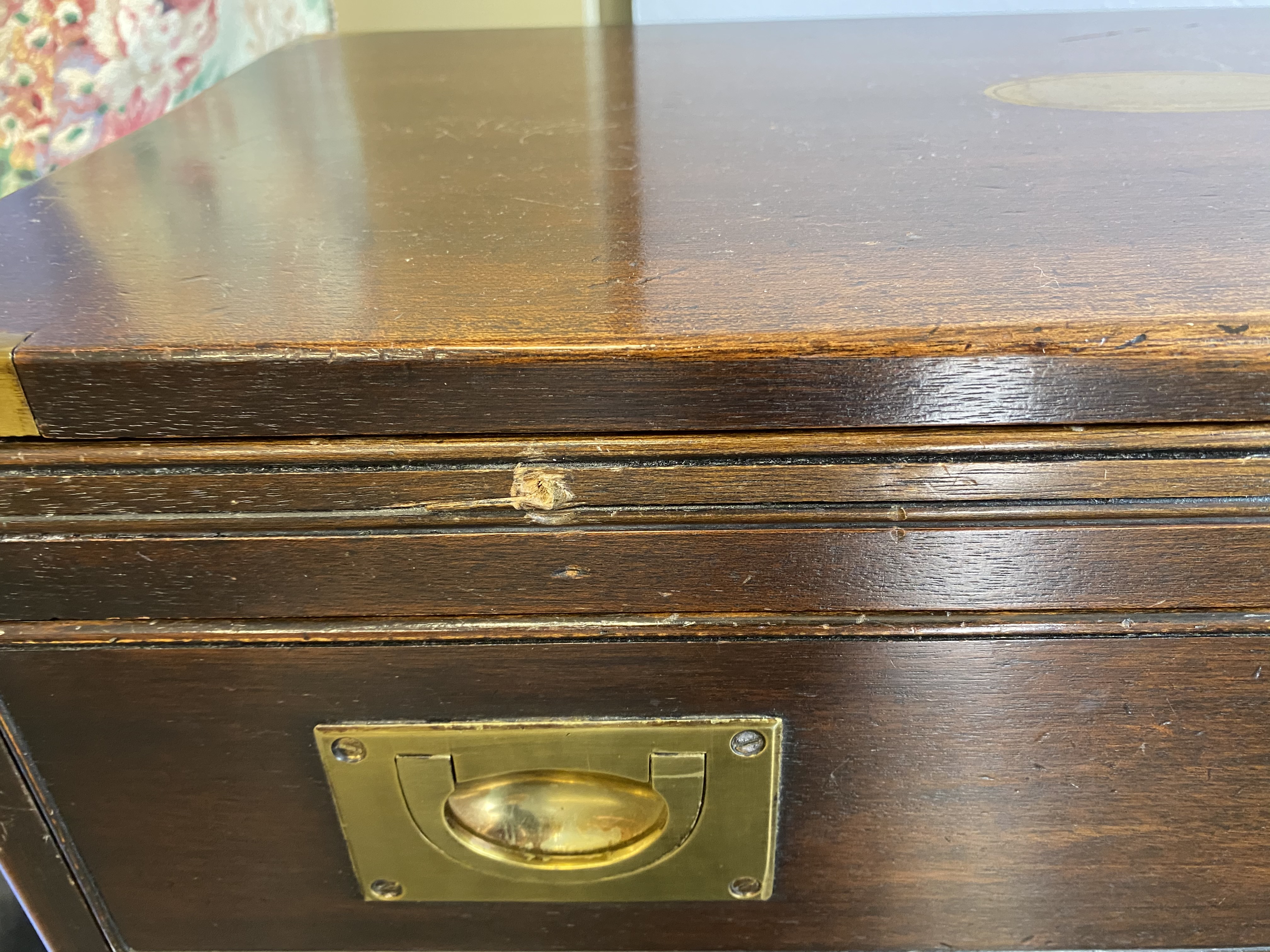 A reproduction mahogany campaign style chest of three drawers, with brushing slide, 61cm wide - Image 7 of 8