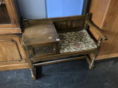 An oak 'Old Charm' telephone seat