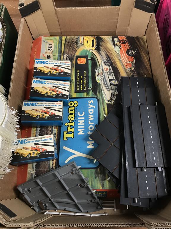 A boxed Tri-Ang 'Minic motorway' and four boxed cars