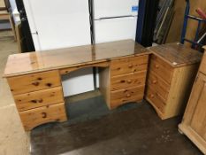 A pine wardrobe, dressing table and bedside drawers