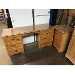 A pine wardrobe, dressing table and bedside drawers