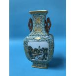 A small Chinese vase, decorated with landscape panels, pierced handles and seal mark to base, 20cm
