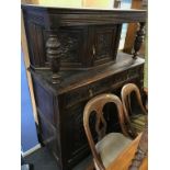 A carved oak court cupboard