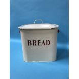 A cream enamel bread bin