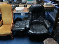 A black leather armchair and footstool