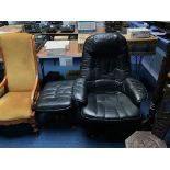 A black leather armchair and footstool