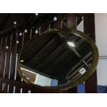 Metal framed oval mirror