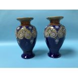 A pair of Royal Doulton stoneware vases, 29cm height