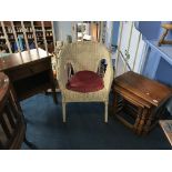 An oak nest of tables, and oak side cabinet and a basket weave chair