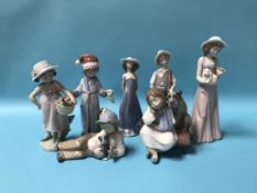 Five Lladro figures and two Nao figures