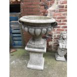A large garden urn and stand