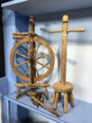 A poss stick and spinning wheel