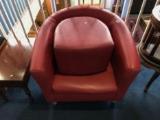 A red tub chair and footstool