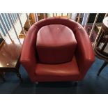 A red tub chair and footstool