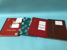 Four stamp albums and contents