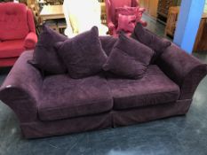 A purple two seater settee