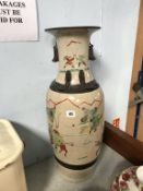 A tall Chinese vase decorated with warriors, 61cm height