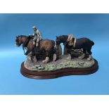 A Border Fine Arts Group of a Man leading two Shire Horses, 36cm wide