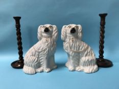Pair of Staffordshire pottery Spaniels and a pair of oak barley twist candlesticks