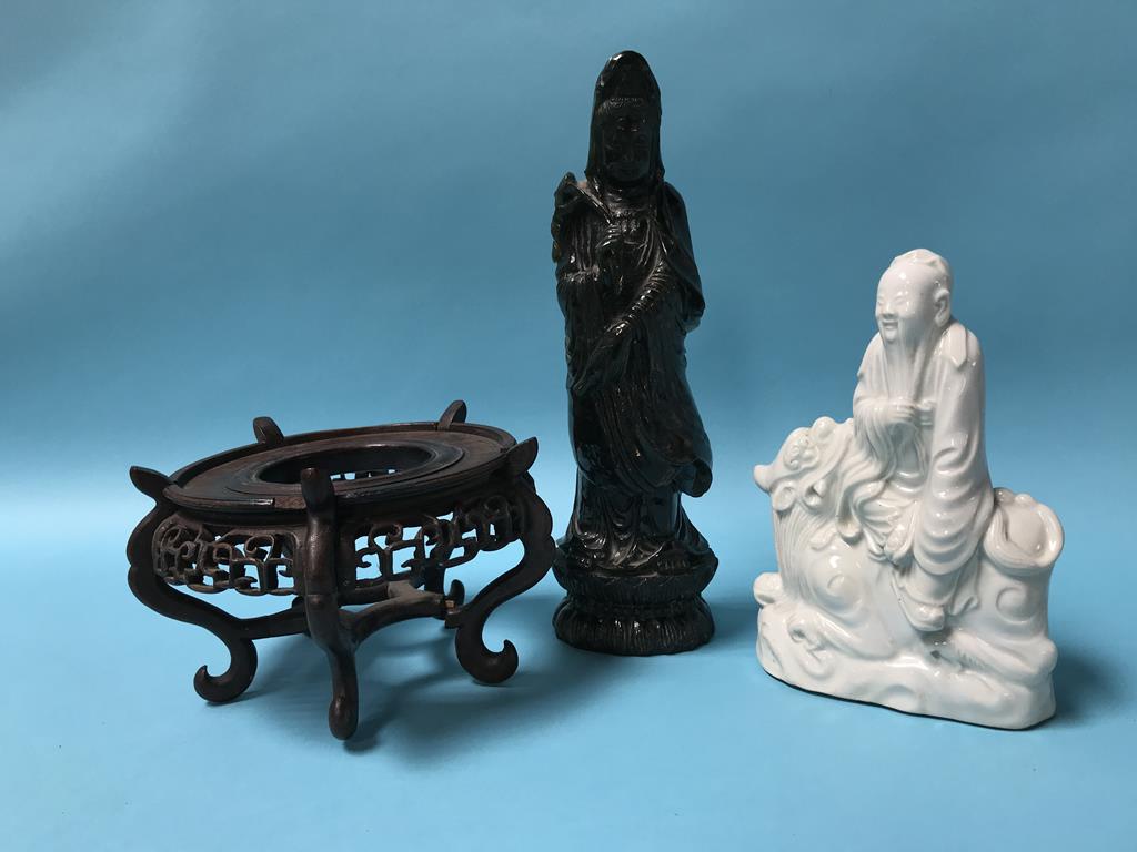 A Chinese blanc de chine figure and a carved sage green figure, 19cm high and 28cm high