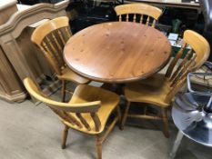 A pine table and chairs