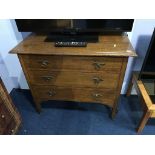 An oak chest of three drawers