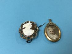 A 9ct mounted Cameo and a 15ct oval brooch