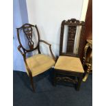 A carved chair and an Edwardian chair