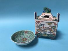 A small Chinese famille rose two handled lidded vase and a miniature dish, 12cm high (2)