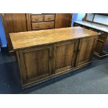 An oak three door cabinet, 168cm wide, 68cm deep