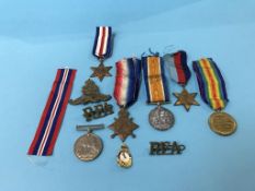 Trio of World War One medals, to 36218 DVR S. Heckels, cap badges etc.